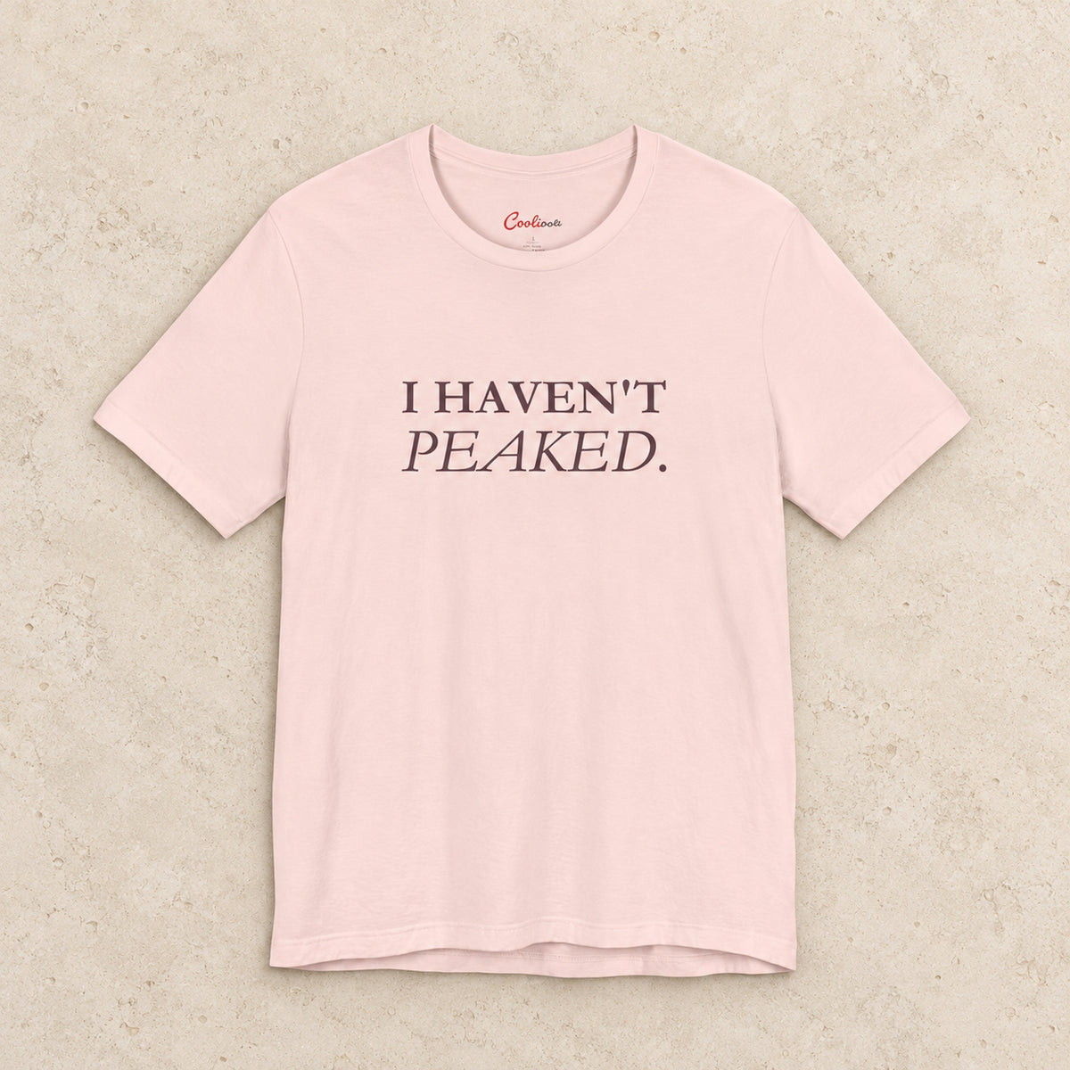 I Haven't Peaked Bella+Canvas 3001 T-shirt in Soft Pink, front flat lay.