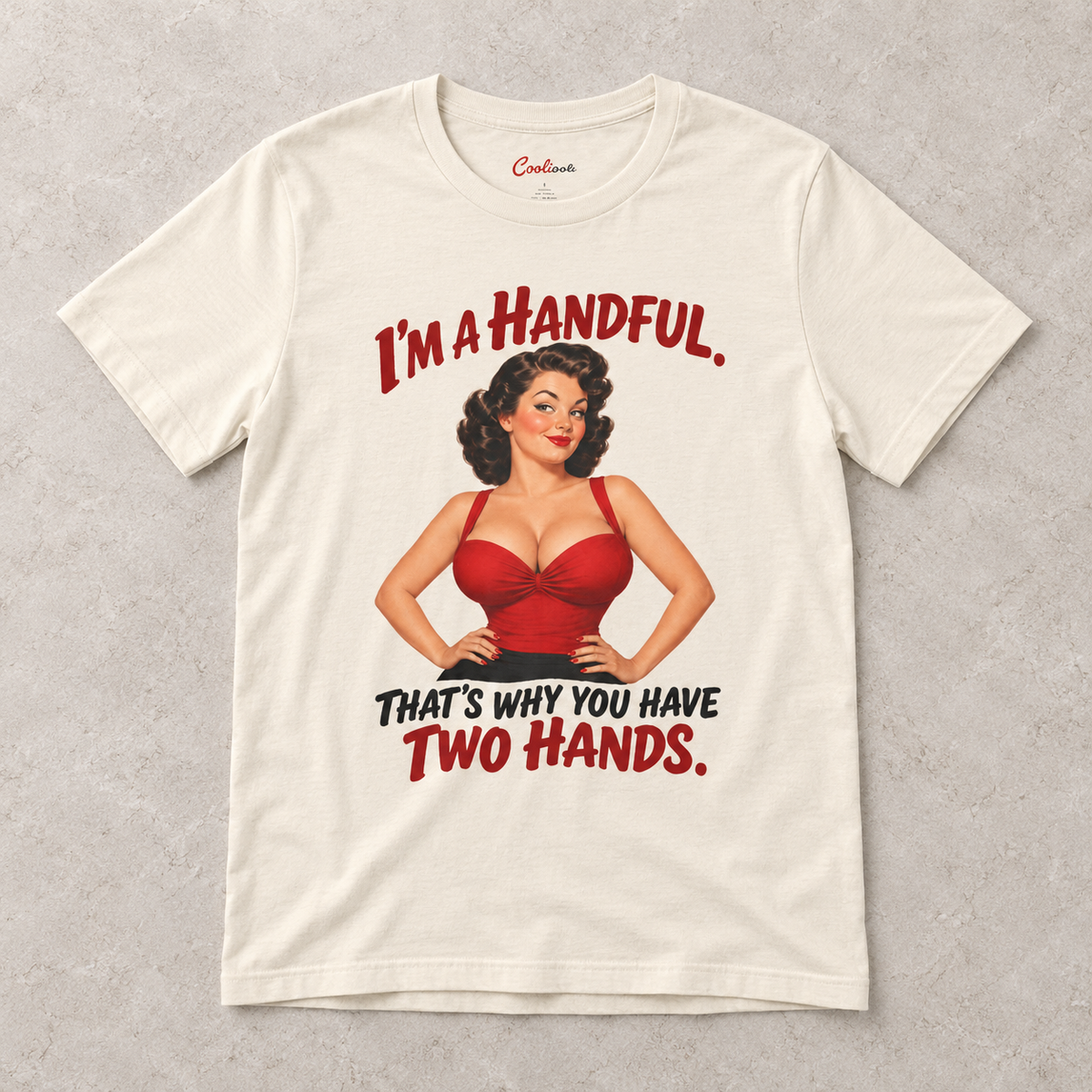 Natural Cooliooli T-shirt with the “I’m a handful. That’s why you have two hands.” pin-up design, front flat lay