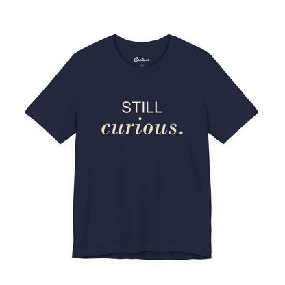 STILL CURIOUS. — Navy Bella+Canvas 3001 full front flat lay