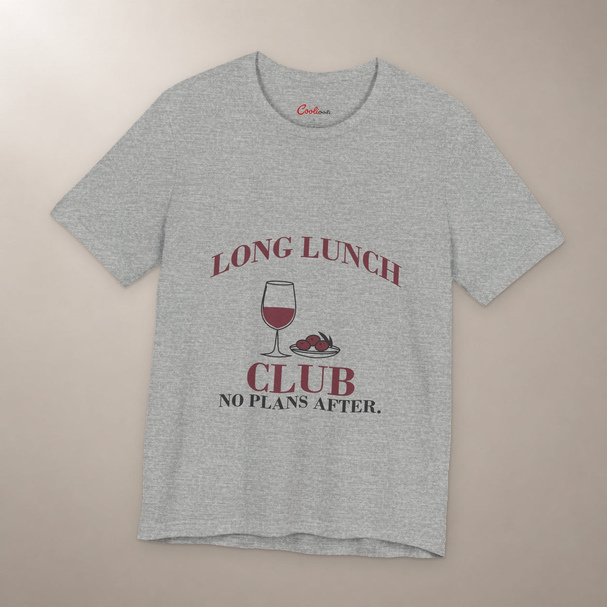 Lunch Is the Whole Agenda. Bella+Canvas 3001 T-shirt in Athletic Heather, front flat lay with Long Lunch Club, No Plans After. lettering with a wine glass and olive dish on a plain warm neutral background.