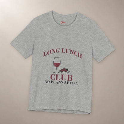 Lunch Is the Whole Agenda. Bella+Canvas 3001 T-shirt in Athletic Heather, front flat lay with Long Lunch Club, No Plans After. lettering with a wine glass and olive dish on a plain warm neutral background.