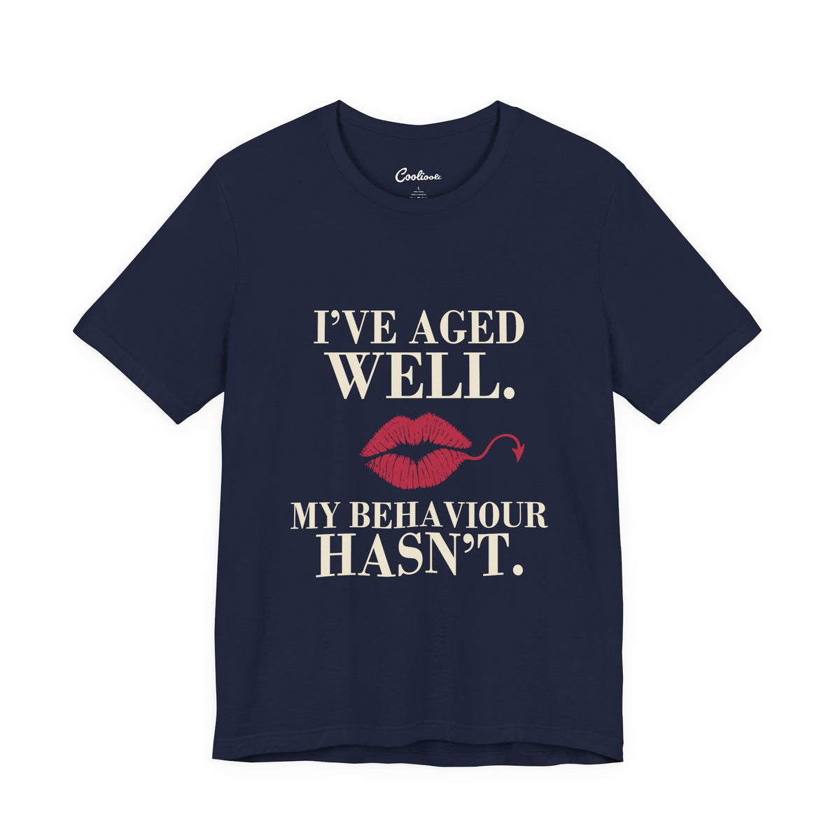 Navy Cooliooli Bella+Canvas 3001 T-shirt with “I’ve aged well. My behaviour hasn’t.” lettering and lipstick kiss with devil tail, front flat lay