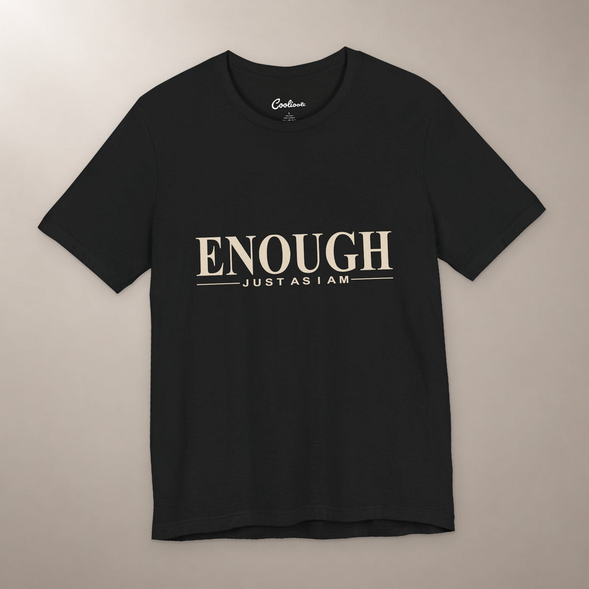 Nothing to Prove. Bella+Canvas 3001 T-shirt in Black, front flat lay with Enough / Just as I am lettering on a plain warm neutral background.