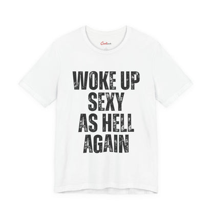 Woke Up Sexy As Hell Again funny statement t-shirt laid flat, bold block capitals across the chest