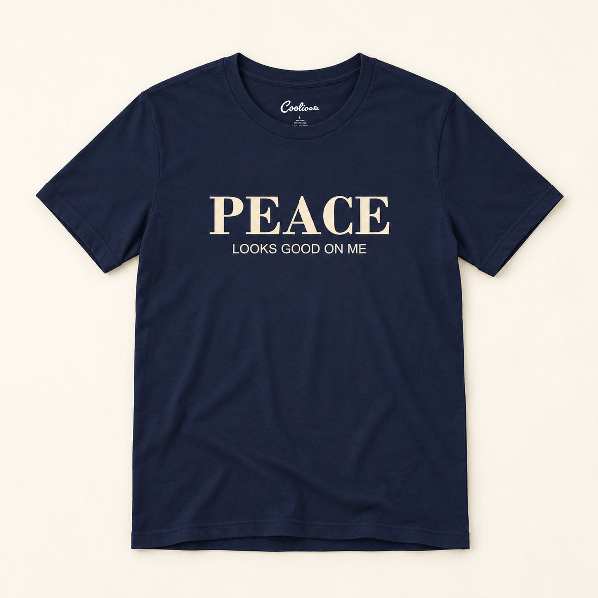 Peace Looks Good on Me affirmation tee in Navy on a warm neutral studio background
