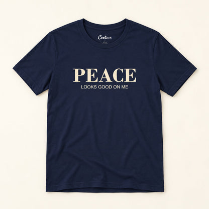 Peace Looks Good on Me affirmation tee in Navy on a warm neutral studio background