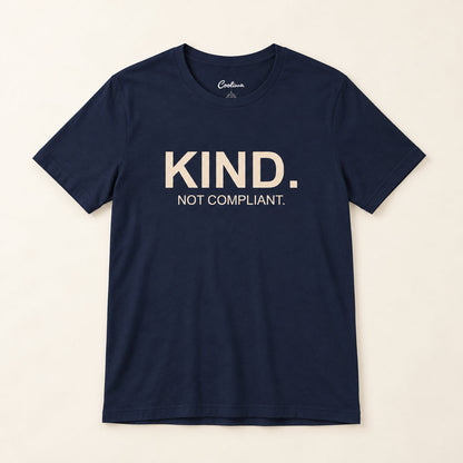 Kind. Not Compliant. affirmation tee in Navy on a neutral studio background