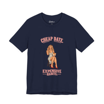 Cheap Date. Expensive Habits. Bella+Canvas 3001 T-shirt in Navy, front flat lay with coral lettering and cream dress, red heels and chips illustration.