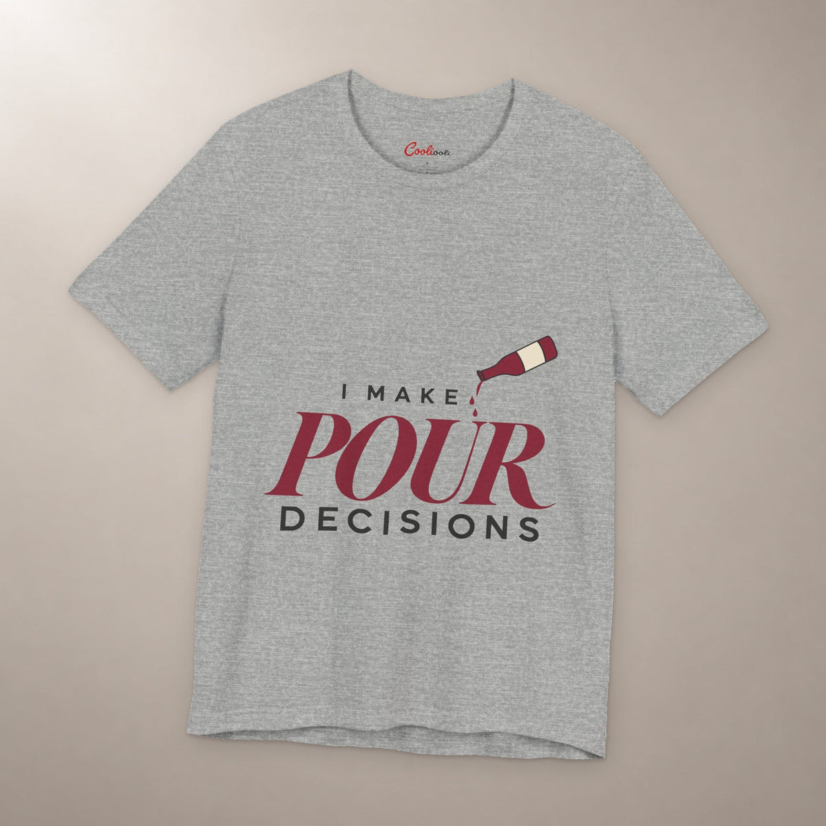 Blame the Vintage. Bella+Canvas 3001 T-shirt in Athletic Heather, front flat lay with I Make Pour Decisions lettering and a tilted wine bottle on a plain warm neutral background.