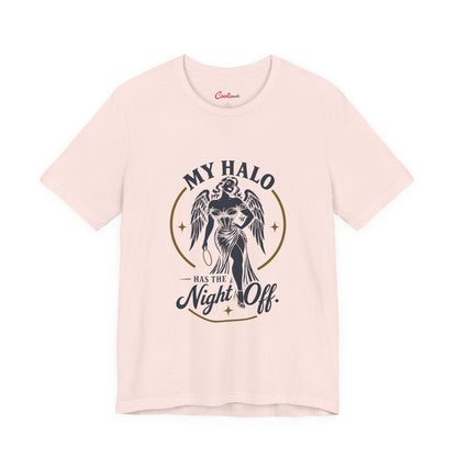 Soft Pink Cooliooli tee with a winged angel holding her halo: My Halo Has the Night Off.
