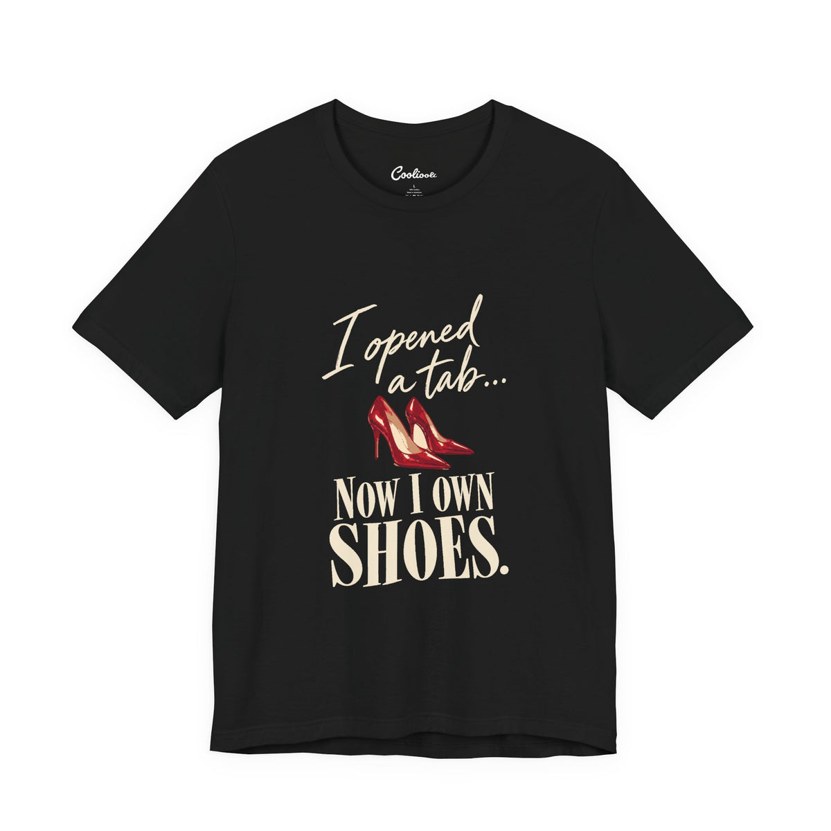 Black Cooliooli T-shirt with red heels and “I opened a tab… Now I own shoes.” lettering, front flat lay