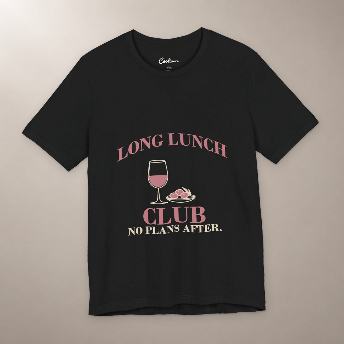 Lunch Is the Whole Agenda. Bella+Canvas 3001 T-shirt in Black, front flat lay with Long Lunch Club, No Plans After. lettering with a wine glass and olive dish on a plain warm neutral background.
