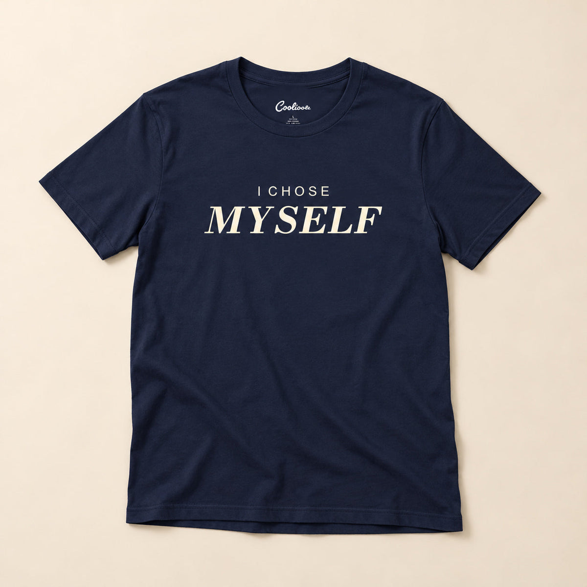 Her First Choice. Navy Bella+Canvas 3001 T-shirt with I CHOSE MYSELF lettering, complete overhead flat lay on a warm neutral background.