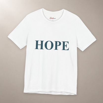 Better Days Look Good on You. Bella+Canvas 3001 T-shirt in White, front flat lay showing HOPE serif lettering on a plain warm neutral background.