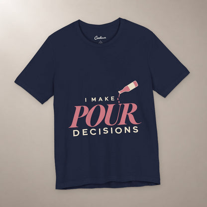 Blame the Vintage. Bella+Canvas 3001 T-shirt in Navy, front flat lay with I Make Pour Decisions lettering and a tilted wine bottle on a plain warm neutral background.