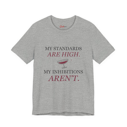 Athletic Heather Cooliooli Bella+Canvas 3001 tee with My standards are high. My inhibitions aren't. lettering and tipped cocktail coupe graphic, front flat lay.