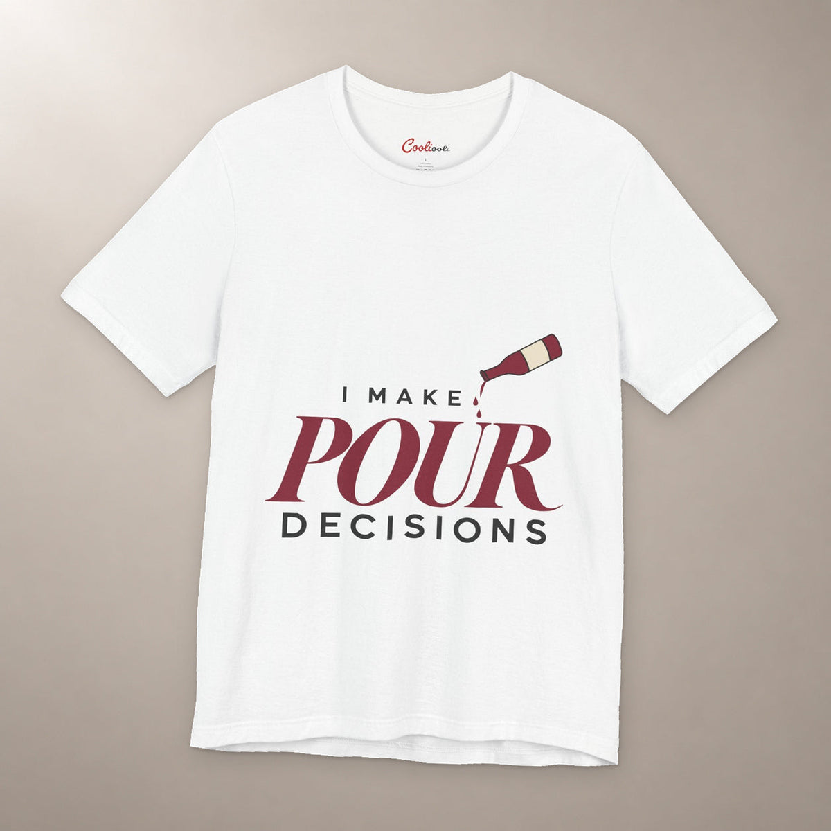Blame the Vintage. Bella+Canvas 3001 T-shirt in White, front flat lay with I Make Pour Decisions lettering and a tilted wine bottle on a plain warm neutral background.