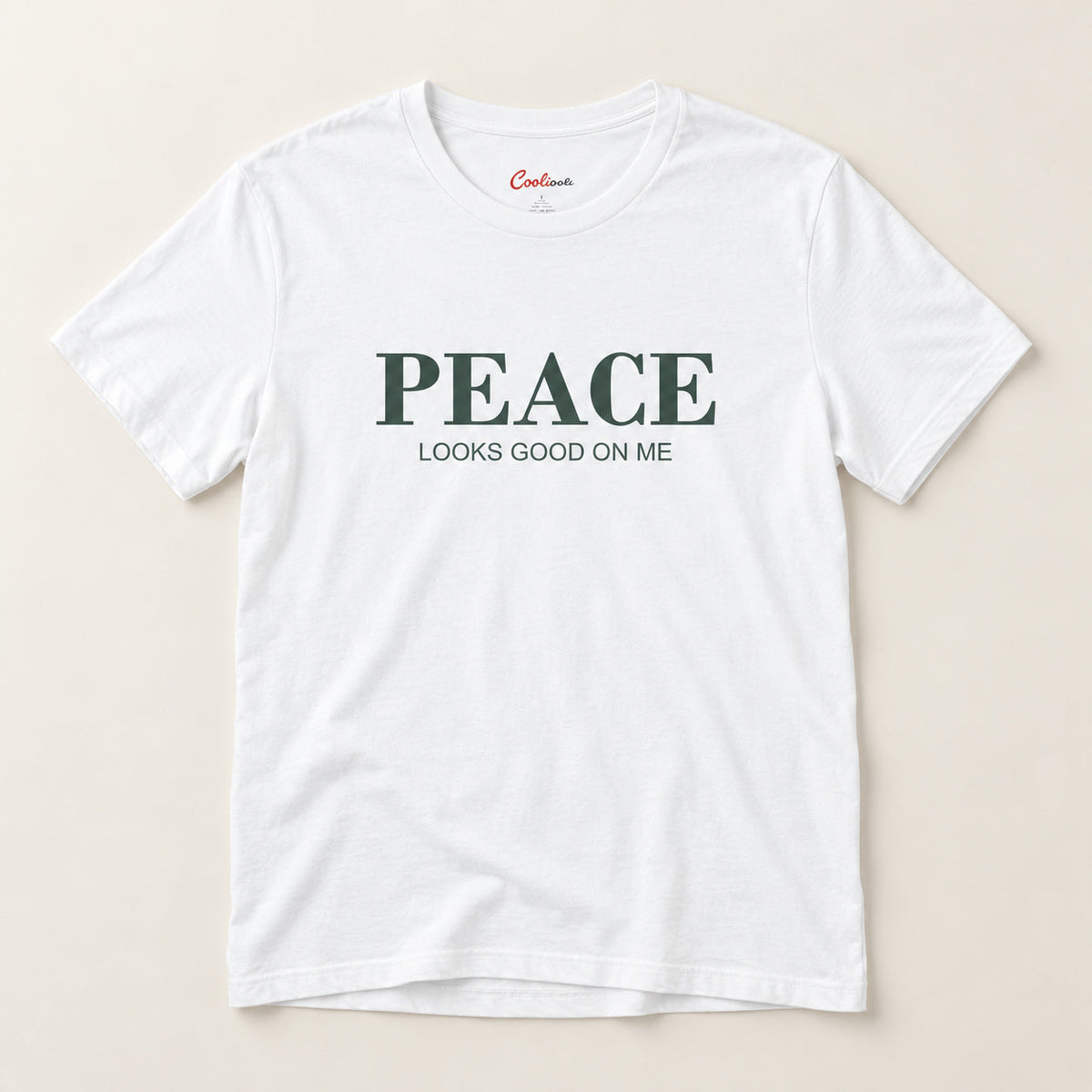 Peace Looks Good on Me affirmation tee in White on a warm neutral studio background