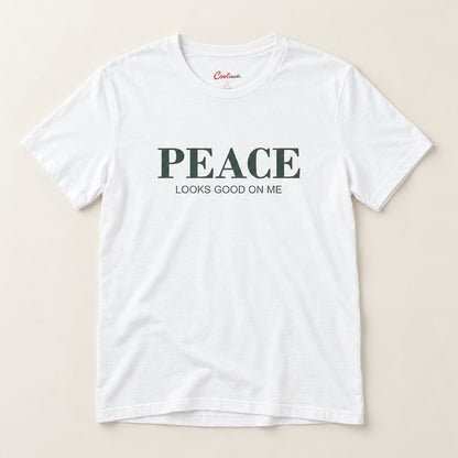 Peace Looks Good on Me affirmation tee in White on a warm neutral studio background