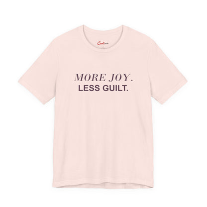 MORE JOY. LESS GUILT. — Soft Pink Bella+Canvas 3001 full front flat lay