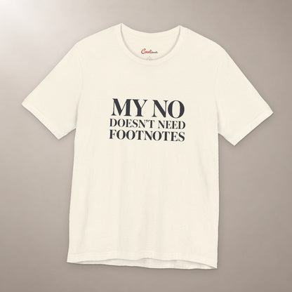 No Means No. Conversation Over. Bella+Canvas 3001 T-shirt in Natural, front flat lay with My No Doesn’t Need Footnotes serif lettering on a plain warm neutral background.