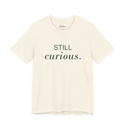 STILL CURIOUS. — Natural Bella+Canvas 3001 full front flat lay