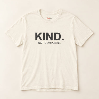 Kind. Not Compliant. affirmation tee in Natural on a neutral studio background