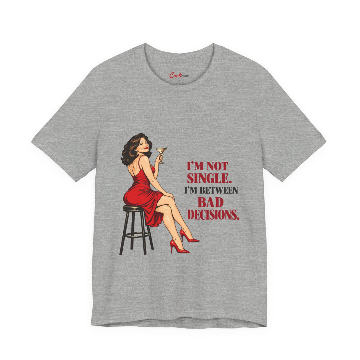 Athletic Heather Bella+Canvas 3001 tee with a woman in a red dress holding a martini and “I'm not single. I'm between bad decisions.” lettering.