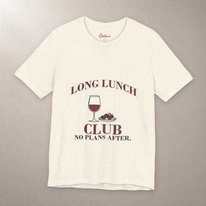 Lunch Is the Whole Agenda. Bella+Canvas 3001 T-shirt in Natural, front flat lay with Long Lunch Club, No Plans After. lettering with a wine glass and olive dish on a plain warm neutral background.