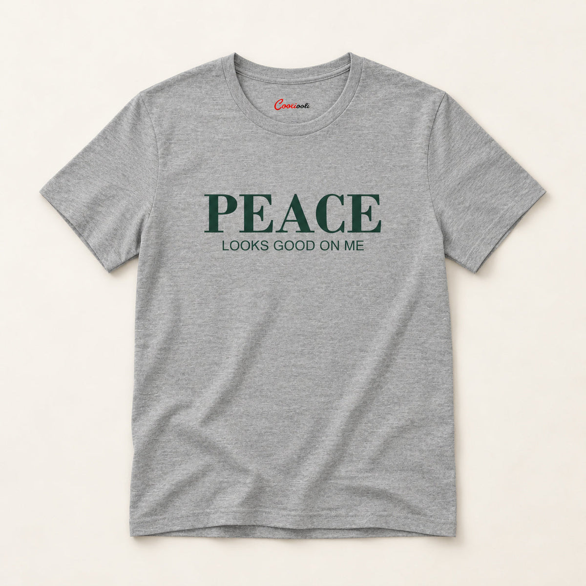Peace Looks Good on Me affirmation tee in Athletic Heather on a warm neutral studio background