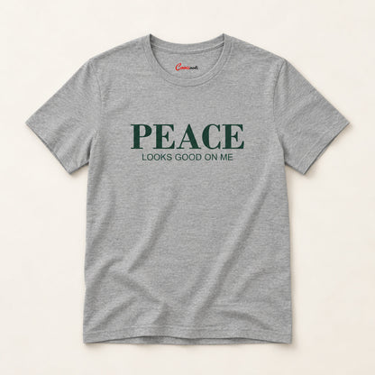 Peace Looks Good on Me affirmation tee in Athletic Heather on a warm neutral studio background