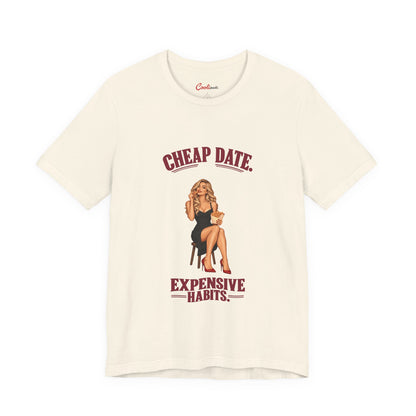 Cheap Date. Expensive Habits. Bella+Canvas 3001 T-shirt in Natural, front flat lay with burgundy lettering and black dress, red heels and chips illustration.