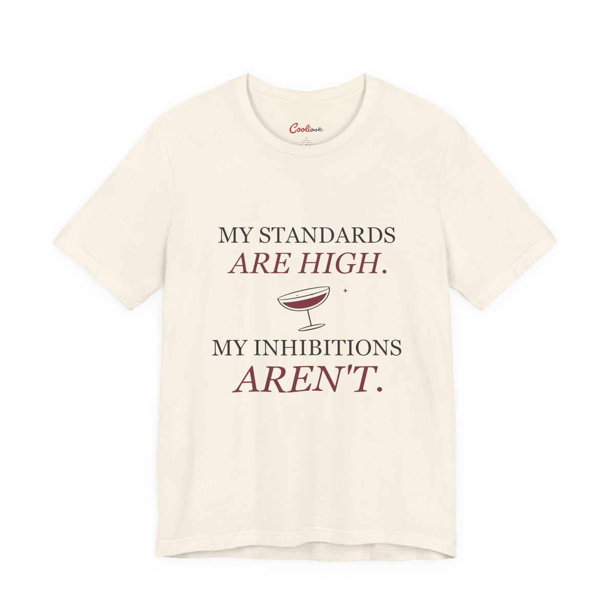 Natural Cooliooli Bella+Canvas 3001 tee with My standards are high. My inhibitions aren't. lettering and tipped cocktail coupe graphic, front flat lay.