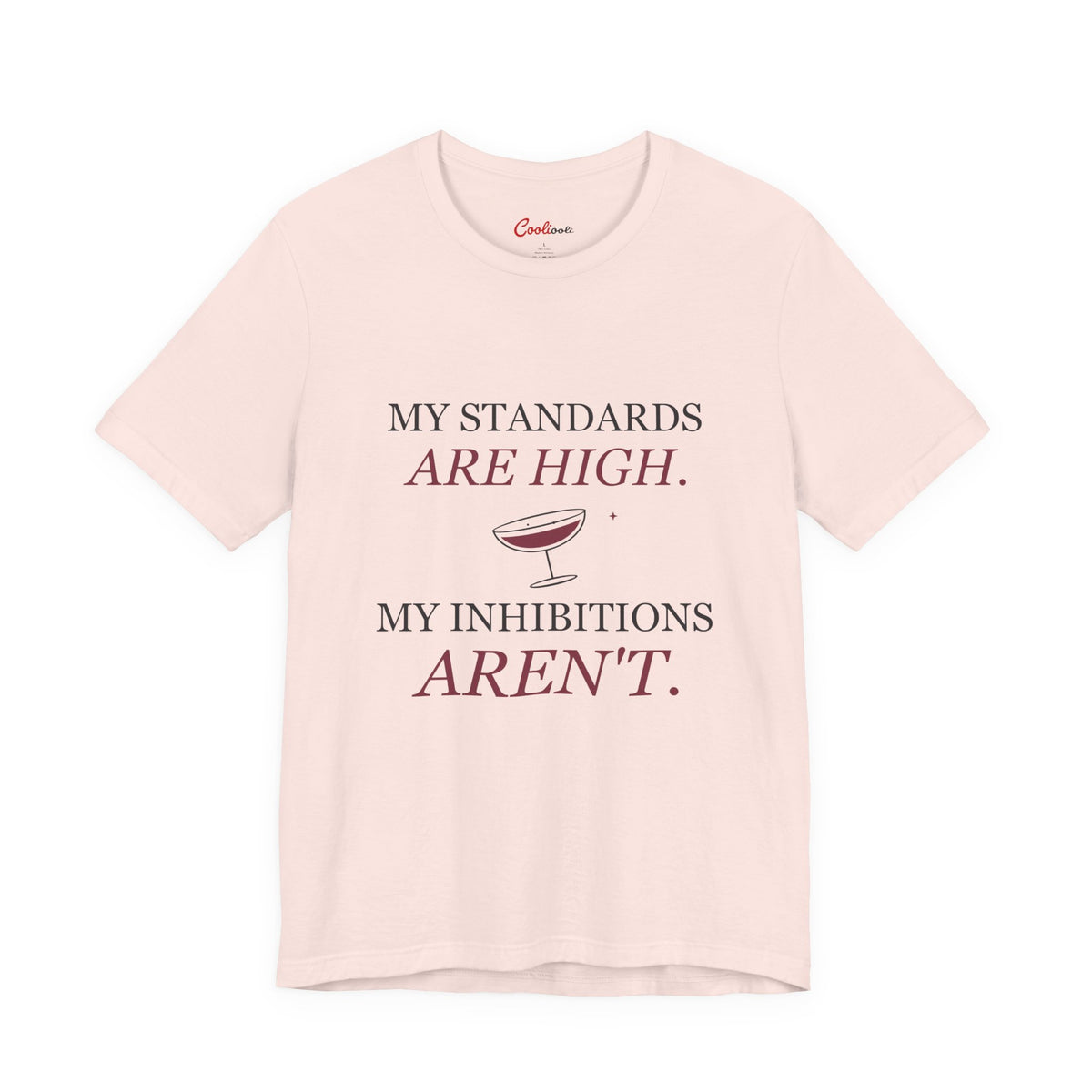 Soft Pink Cooliooli Bella+Canvas 3001 tee with My standards are high. My inhibitions aren't. lettering and tipped cocktail coupe graphic, front flat lay.