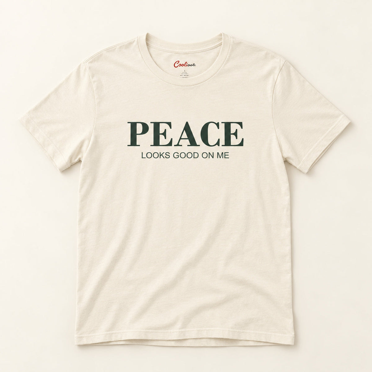 Peace Looks Good on Me affirmation tee in Natural on a warm neutral studio background