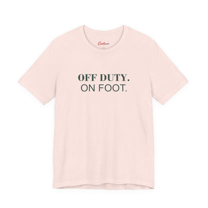 OFF DUTY. ON FOOT. on the Soft Pink Bella+Canvas 3001 tee — accurate supplier front colour mockup