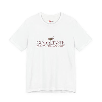 White Cooliooli tee with cocktail illustration and lettering: Good taste. Questionable decisions.