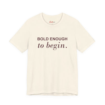 BOLD ENOUGH TO BEGIN. — Natural Bella+Canvas 3001 full front flat lay