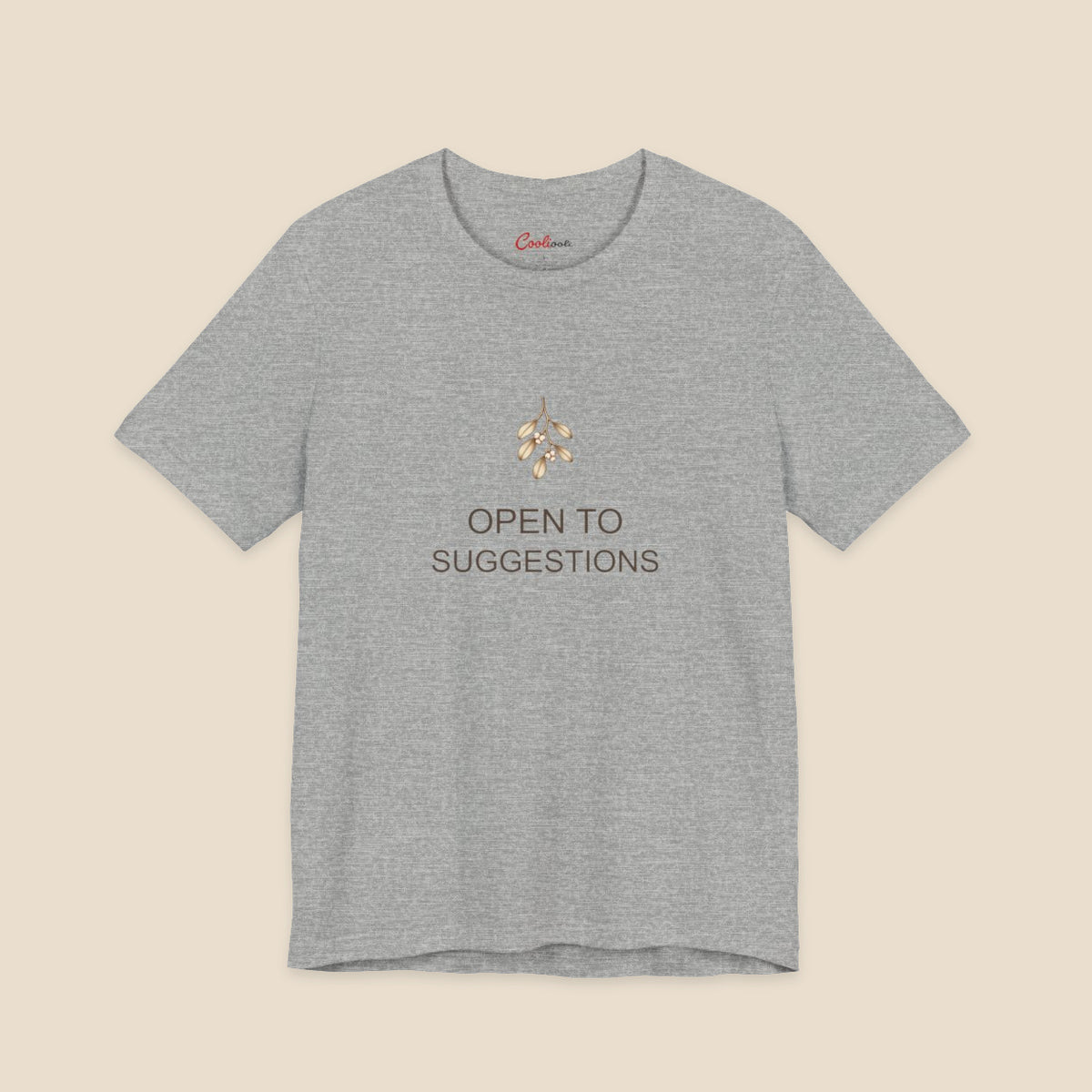 Athletic Heather Bella+Canvas3001 Christmas T-shirt with a small bronze and cream mistletoe graphic and Open to Suggestions lettering.