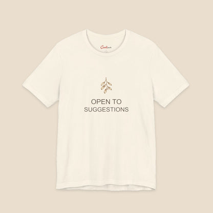 Natural Bella+Canvas3001 Christmas T-shirt with a small bronze and cream mistletoe graphic and Open to Suggestions lettering.