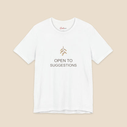White Bella+Canvas3001 Christmas T-shirt with a small bronze and cream mistletoe graphic and Open to Suggestions lettering.