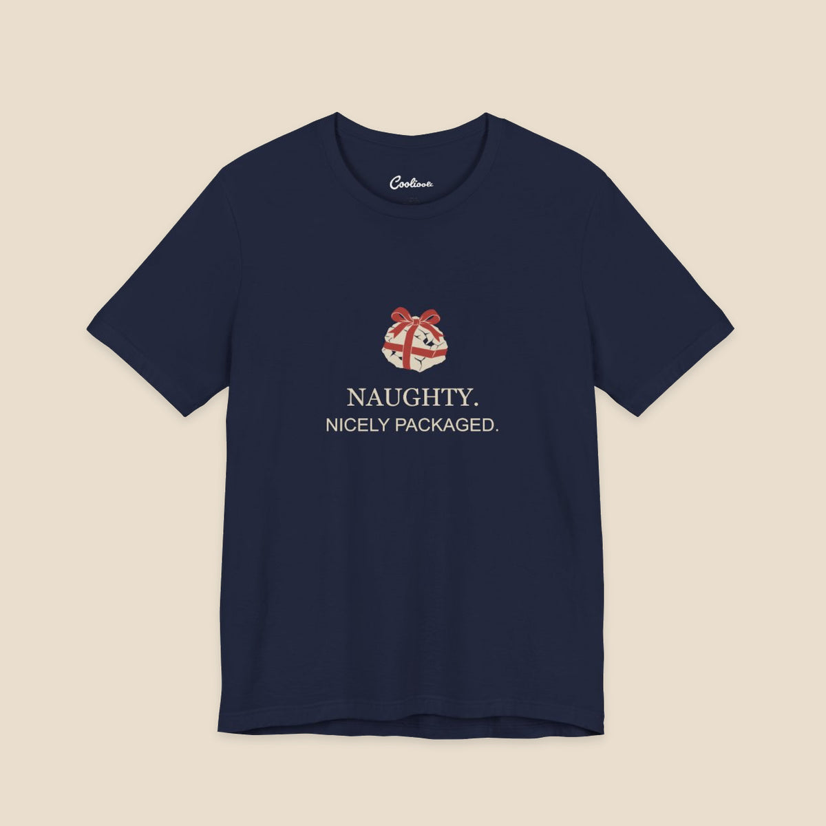 Navy Bella+Canvas 3001 Christmas T-shirt with an original coal and red bow illustration above Naughty. Nicely Packaged. lettering.