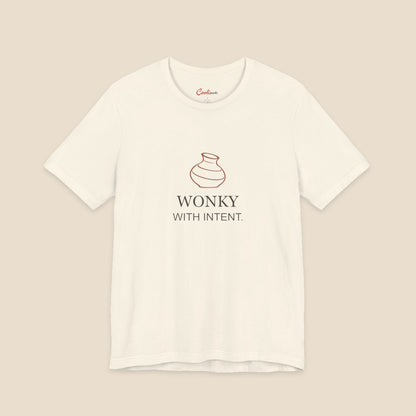 Natural Bella+Canvas 3001 pottery T-shirt with an uneven terracotta vase above Wonky With Intent lettering.