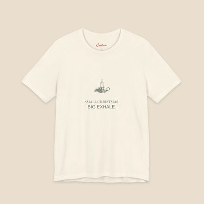 Small Christmas Big Exhale candle graphic on a Natural Bella+Canvas 3001 unisex tee; front colour preview.