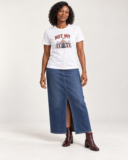 Amara wearing the White NOT MY circus tent Bella+Canvas3001 unisex tee with a denim maxi skirt and oxblood ankle boots in a pale studio.