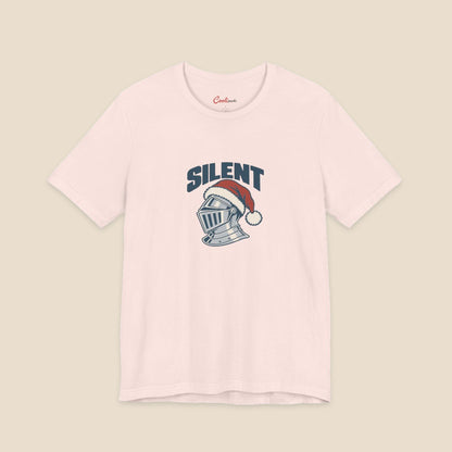 SILENT and original silver-grey knight helmet in a red Santa hat on the Soft Pink Bella+Canvas 3001 unisex tee; front colour preview.