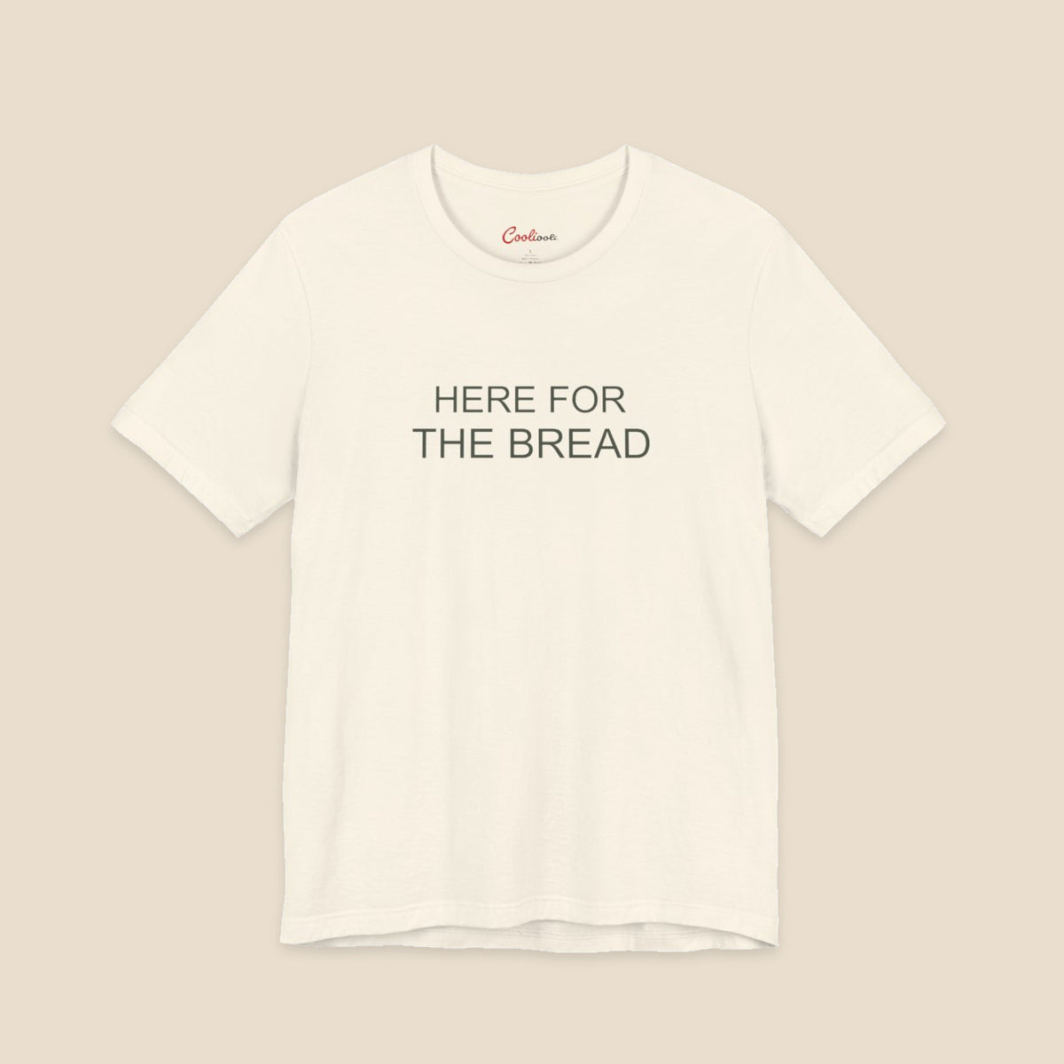 Natural Bella+Canvas3001 T-shirt with the Here for the Bread two-line chest design.