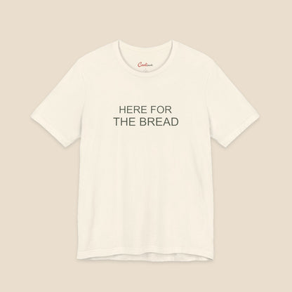 Natural Bella+Canvas3001 T-shirt with the Here for the Bread two-line chest design.