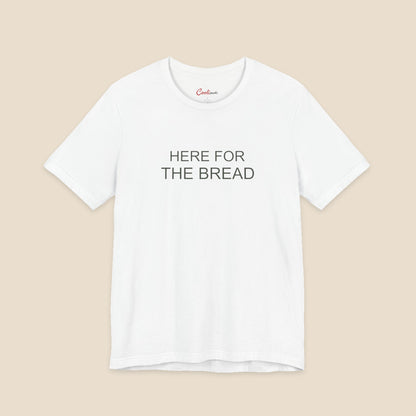 White Bella+Canvas3001 T-shirt with the Here for the Bread two-line chest design.