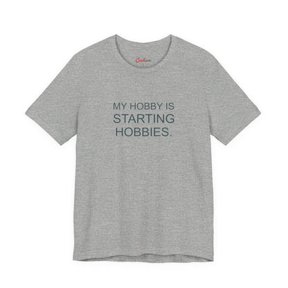My Hobby Is Starting Hobbies Bella+Canvas3001 T-shirt in Athletic Heather, full front supplier flat lay.